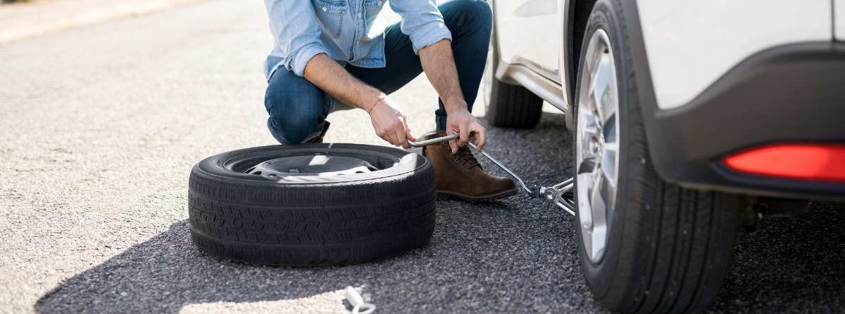 Man changing a flat tire
