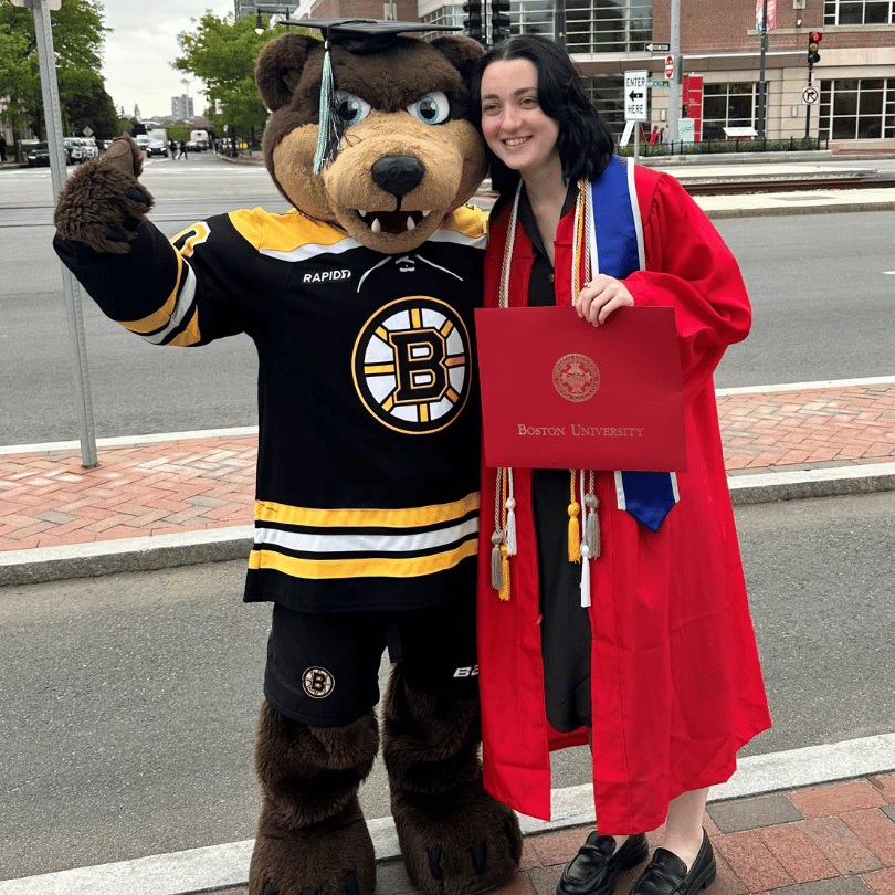 Blades mascot posing with BU Grad, wearing her graduation cap