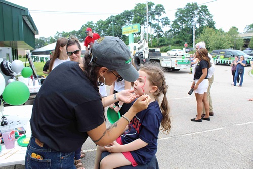 A child getting their face painted