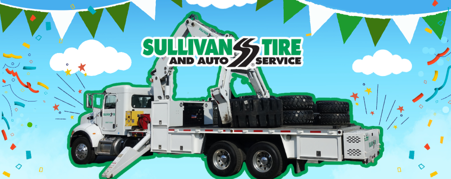banner featuring the sullivan tire logo, confetti, banners, and a commercial division boom truck