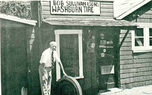 A photo of Bob Sullivan in front of the first Sullivan Tire location in Rockland, MA