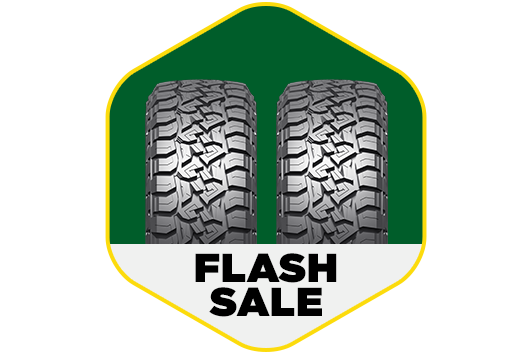 Two tires with the text "FLASH SALE" underneath in a hexagon.
